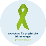 In einem blauen Kreis ist die grüne Schleife als Symbol abgebildet. Darunter steht der Slogan: Akzeptanz für psychische Erkrankungen. Es wird auf die Homepage: grueneschleife.com hingewiesen.