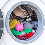 Concept of saving electricity with a washing machine with a pigg