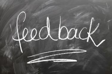 Lettering of the word feedback ona school board