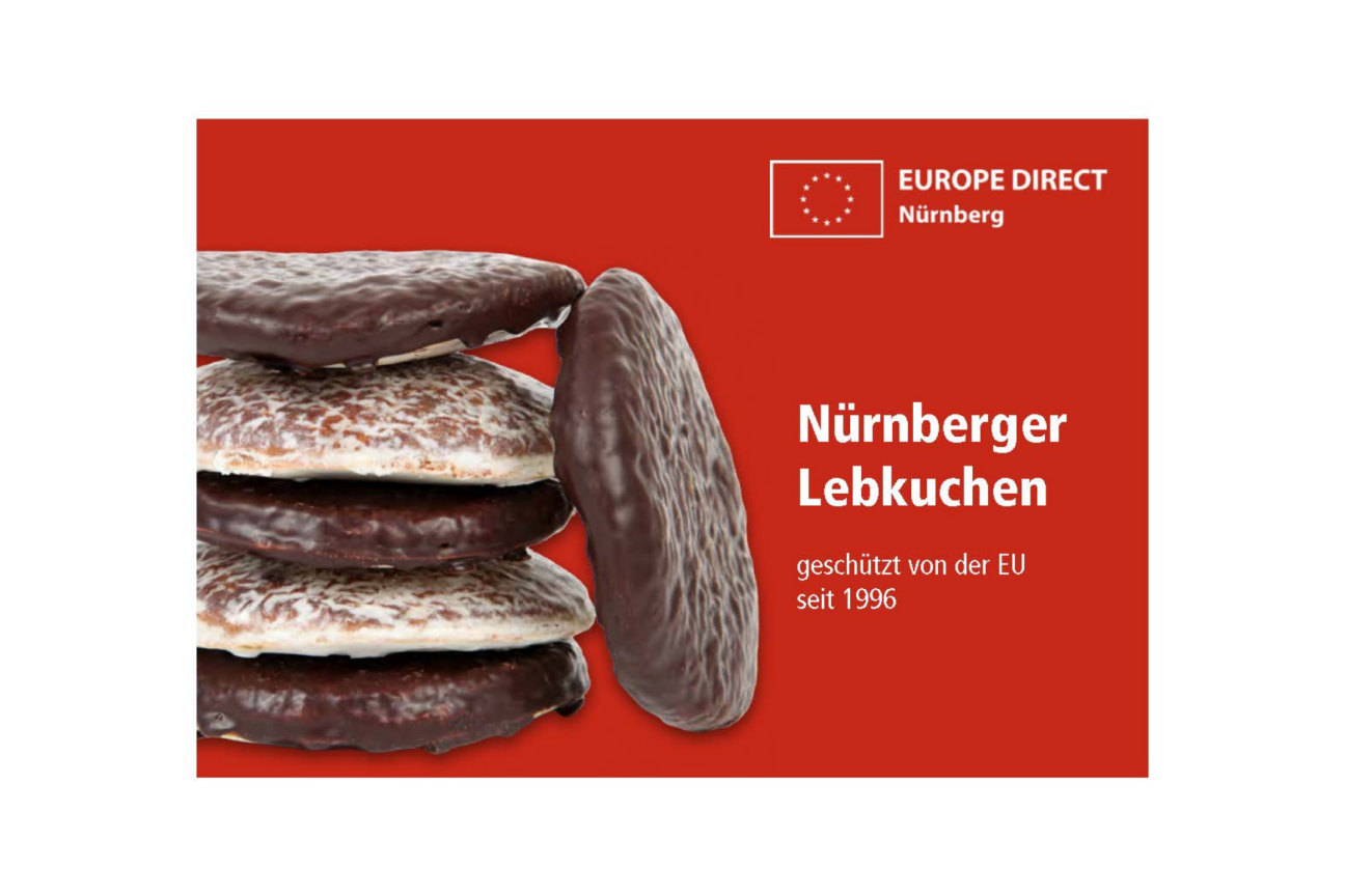 Nürnberger Lebkuchen mit Schoko- und Zitronenguss auf rotem Hintergrund mit dem Logo des EUROPE DIRECT Nürnberg. Der Text sagt Nürnberger Lebkuchen geschützt von der EU seit 1996., Bild © ED Nürnberg / Adobe Stock