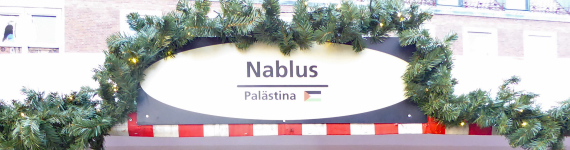 Schild der Nablus Bude am Markt der Partnerstädte