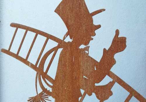 Figur eines Schornsteinfegers aus Blech