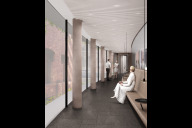 Bild  
Verbindungsgang im rückwärtigen Bereich des Ergänzungsbaus mit Blick auf die Bestandsfassade. Über diesen Gang kann das Publikum von einer Seite des Zuschauersaals zur anderen gelangen.

