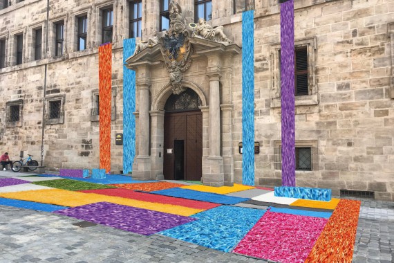 Bunte Kunstrasenteppiche vor dem Alten Rathaus