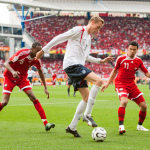 Jun 15, 2006; Nuremberg, GERMANY; England forward (21) Peter Crouch plays the ball as Trinidad and Tobago defender (6) Dennis Lawrence and midfielder (11) Carlos Edwards approach during first half play in first round group B action of the 2006 FIFA World Cup at Franken-Stadion Nuremberg. England defeated Trinidad and Tobago 2-0. Mandatory Credit: Ron Scheffler. Copyright © Ron Scheffler