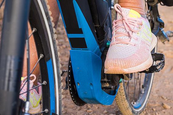 Close-up view of the engine and battery of an electric bicycle.