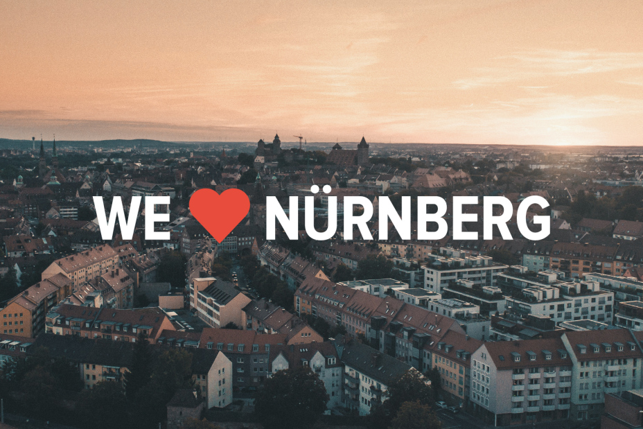 Das Vorschaubild für den Imagefilm We love Nürnberg zeigt die Stadt von oben im Sonnenaufgang.