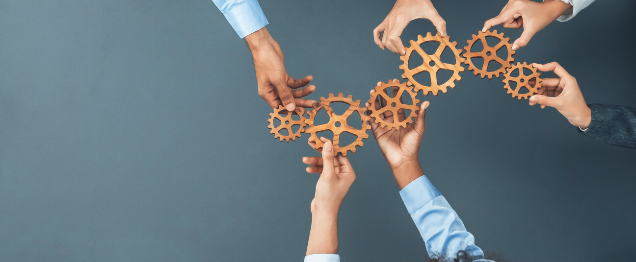 Panoramic shot top view of business people holding cog wheel as unity and teamwork in corporate workplace concept. Office worker colleague with symbol of visionary system for business success. Concord, Bild © AdobeStock