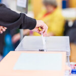 political referendum polling choice voter background with copy space. democratic system. Hispanic voter holding an envelope in an electoral college